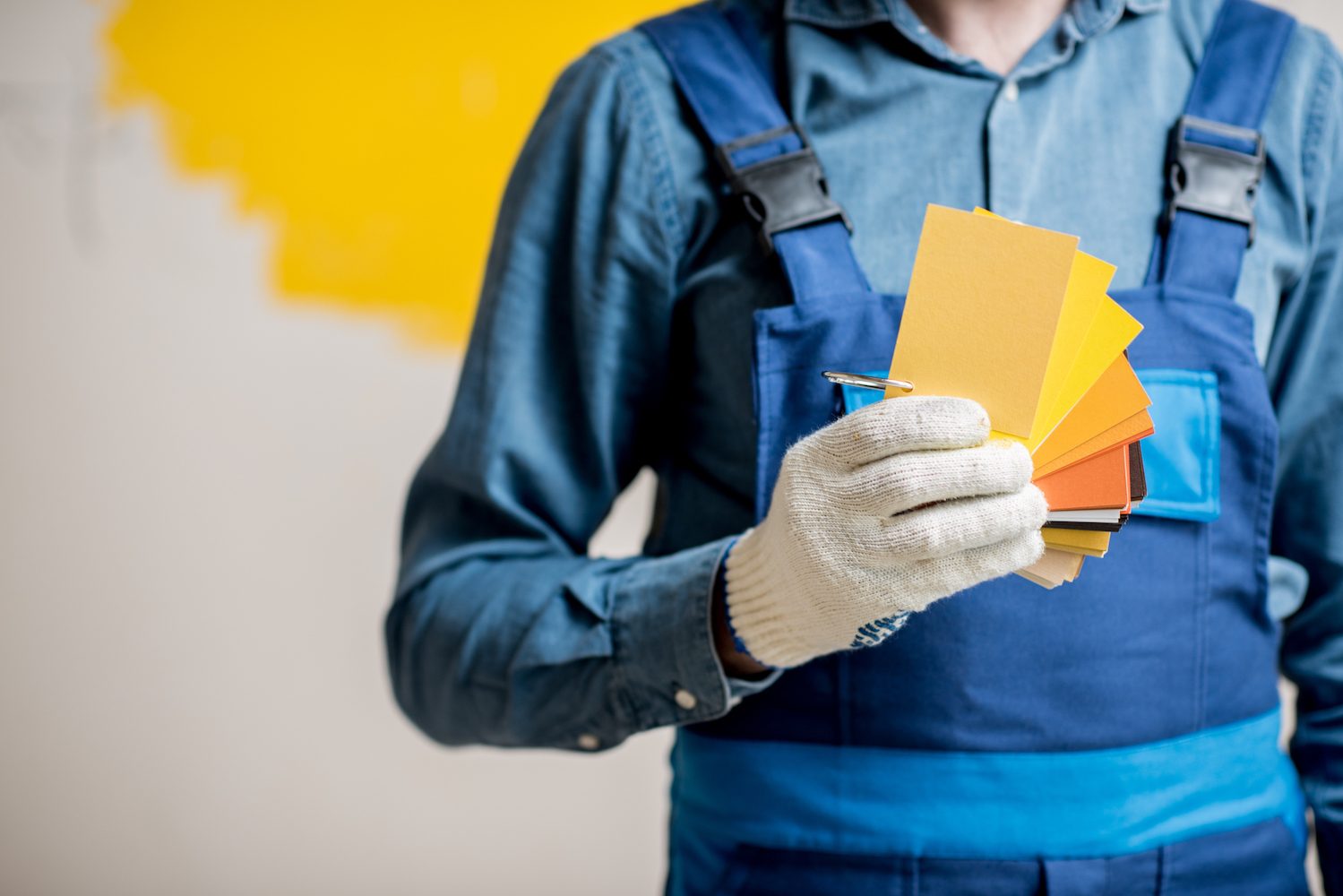 Painter with color swatches indoors